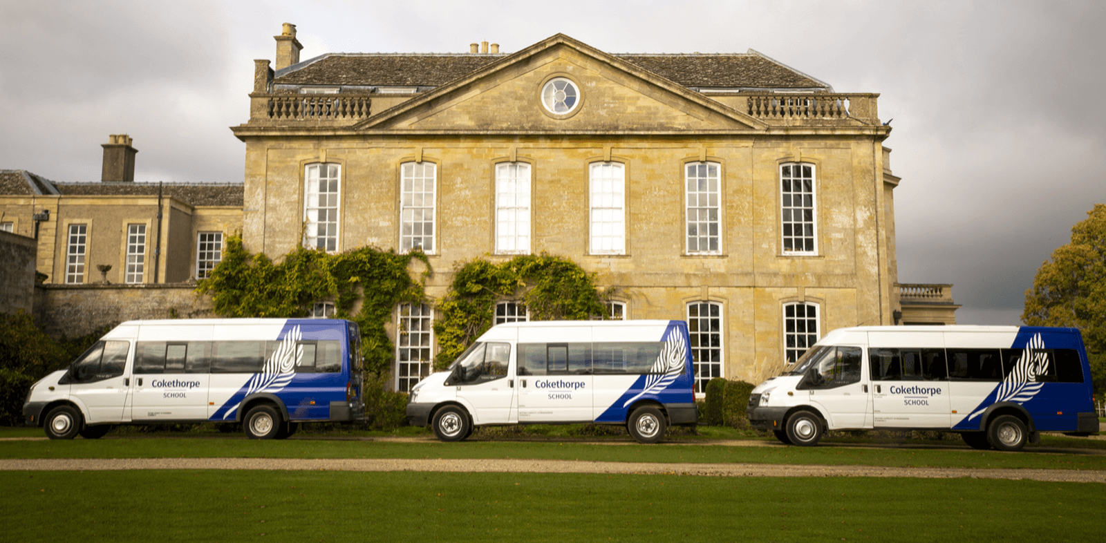 Cokethorpe Minibusses parkewd outsode Mansion House - Cokethorpe's Transport Network - An Independent Day School