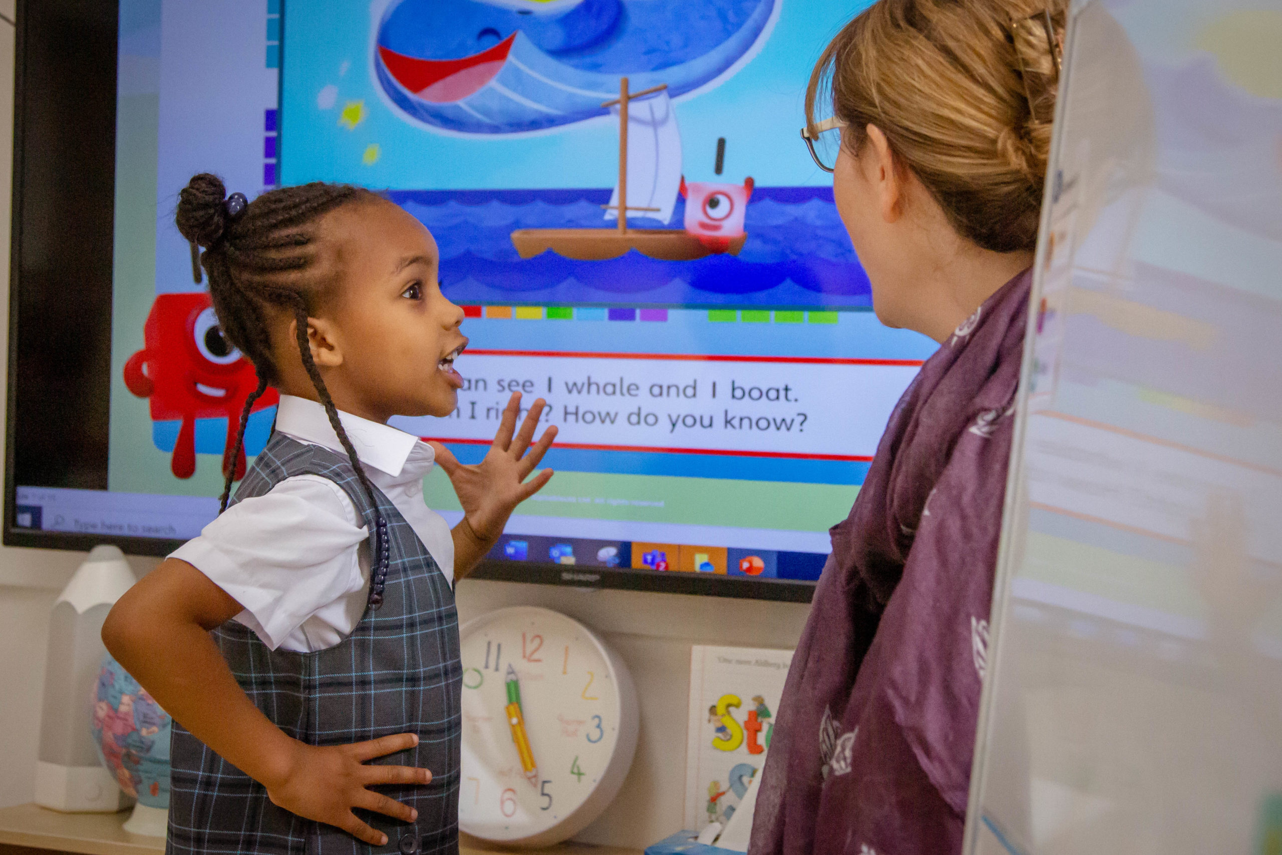 Pre-Prep child interacting with teacher in class