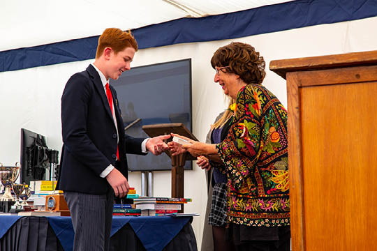 Senior Pupil receiving an award at Cokethorpe Senior School Prize Giving - Dr Marlys Witte - News