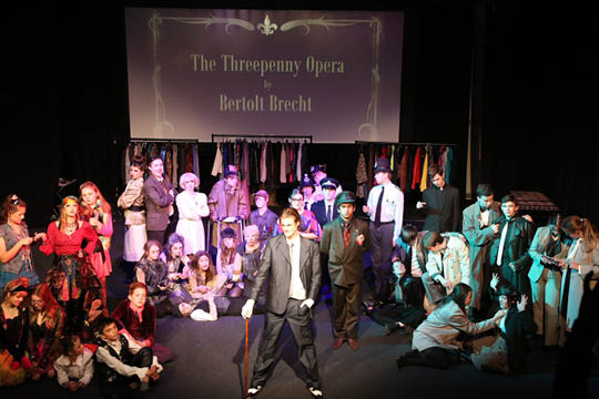 The cast of The Threepenny Opera on stage - Cokethorpe Drama