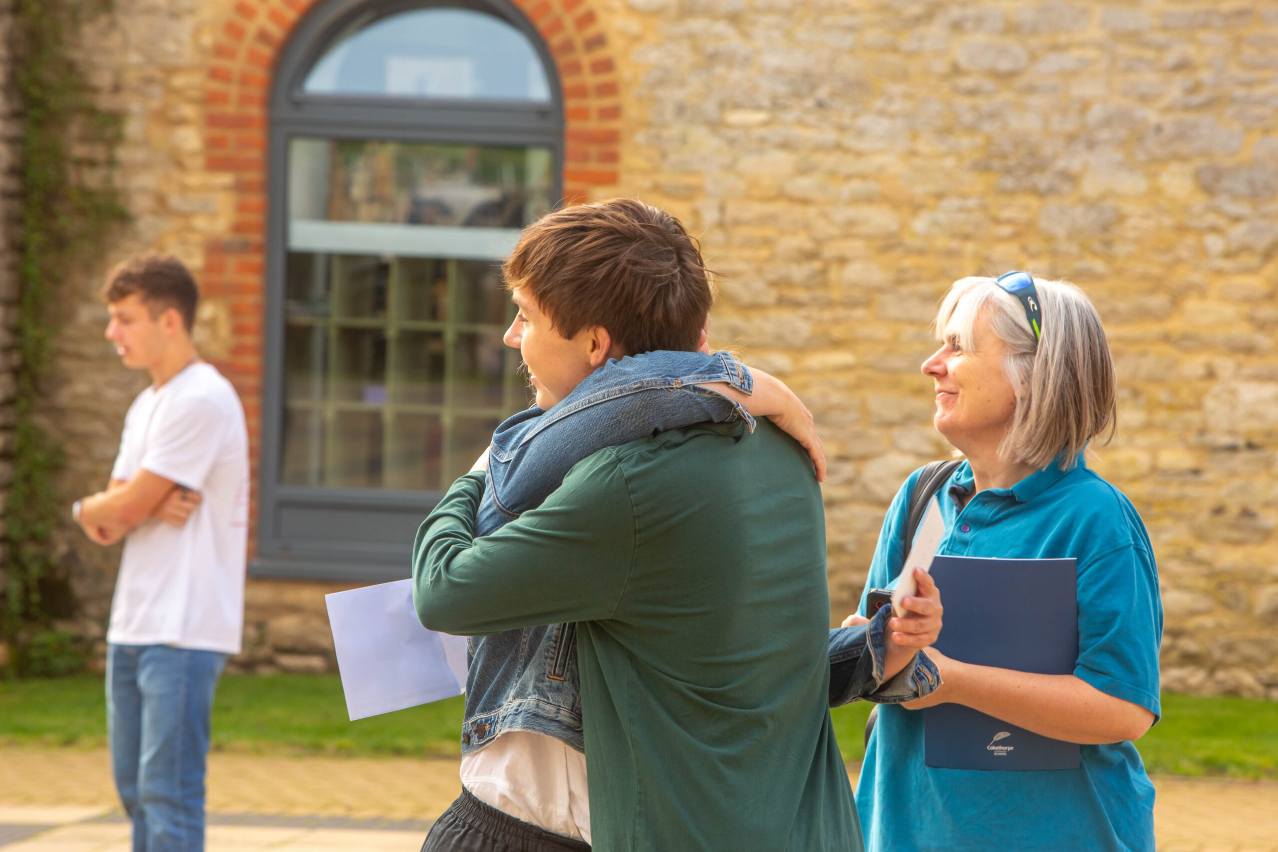 A-Level Results - Students hugging and happy